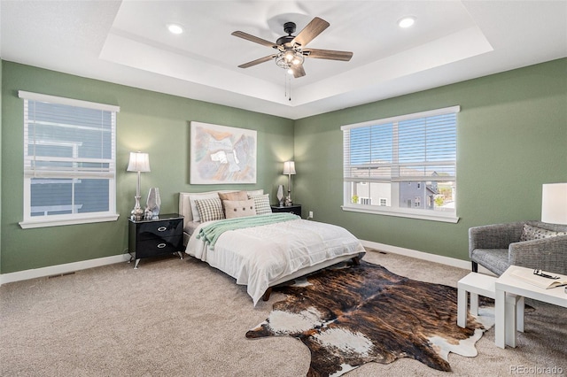 1953 Morgan Dr, Erie, CO 80516 - carpeted bedroom with a raised ceiling, baseboards, recessed lighting, and a ceiling fan