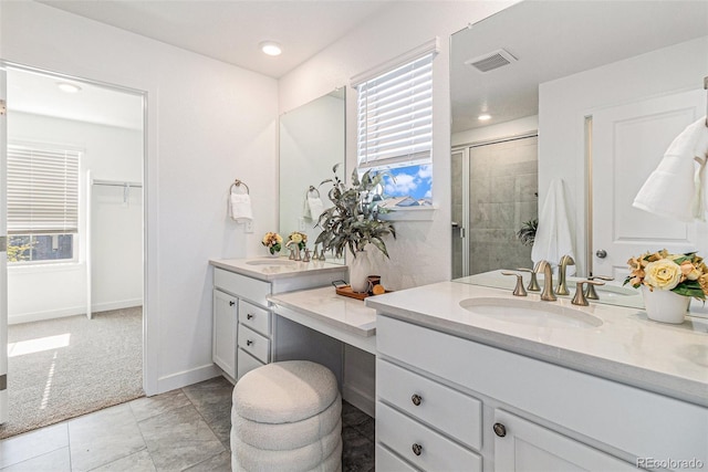 1953 Morgan Dr, Erie, CO 80516 - bathroom with a shower stall, vanity, healthy amount of natural light, baseboards, and recessed lighting