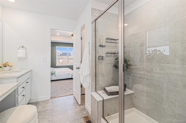 1953 Morgan Dr, Erie, CO 80516 - full bathroom featuring vanity, ensuite bathroom, a stall shower, ceiling fan, and recessed lighting