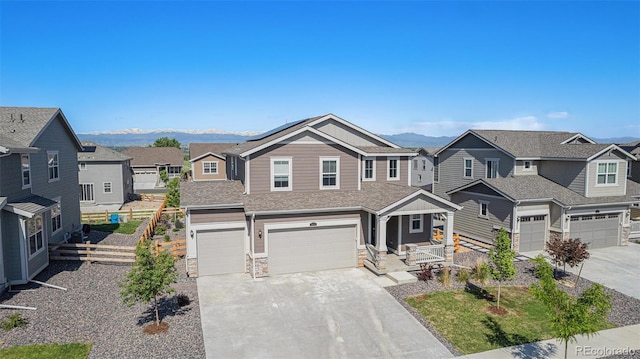 1953 Morgan Dr, Erie, CO 80516 - view of front of home with a garage, driveway, a residential view, and a mountain view