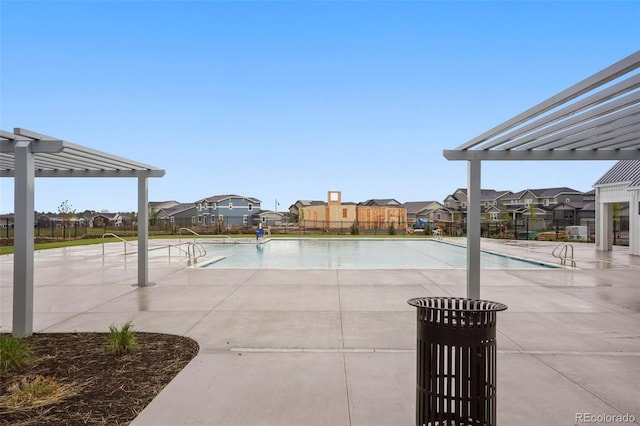1953 Morgan Dr, Erie, CO 80516 - community pool featuring a pergola, a residential view, and a patio
