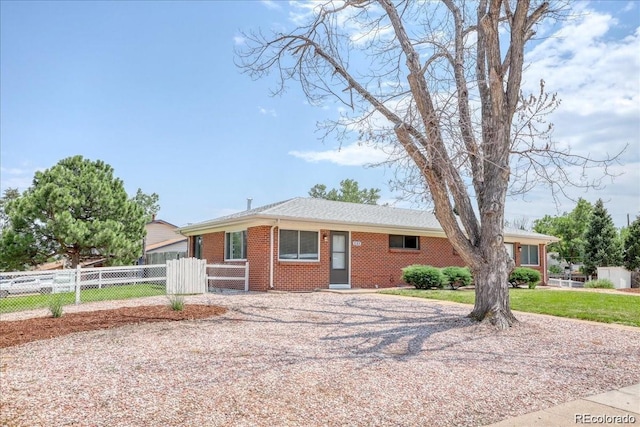 ranch-style house with a front lawn