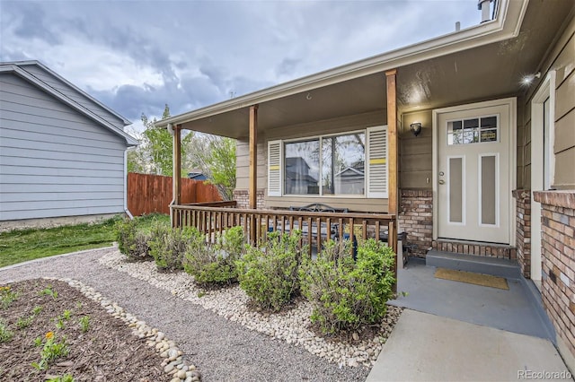 entrance to property featuring a porch