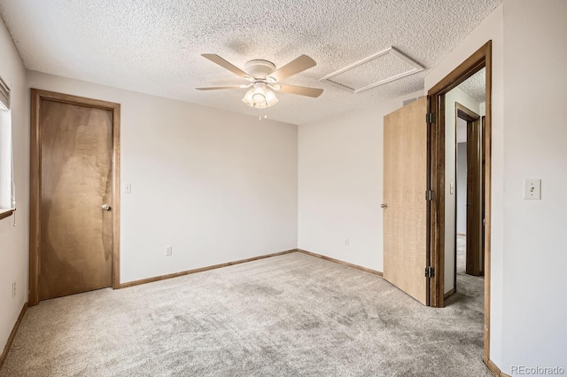 unfurnished room with light carpet, a textured ceiling, and ceiling fan