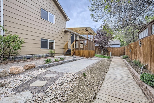 view of yard featuring a pergola and a wooden deck