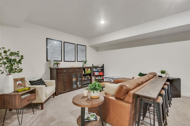living room featuring light colored carpet and recessed lighting