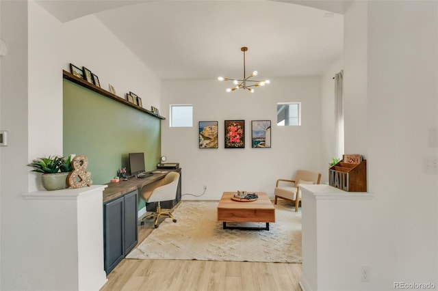 interior space with light wood-style floors, a chandelier, and a wealth of natural light
