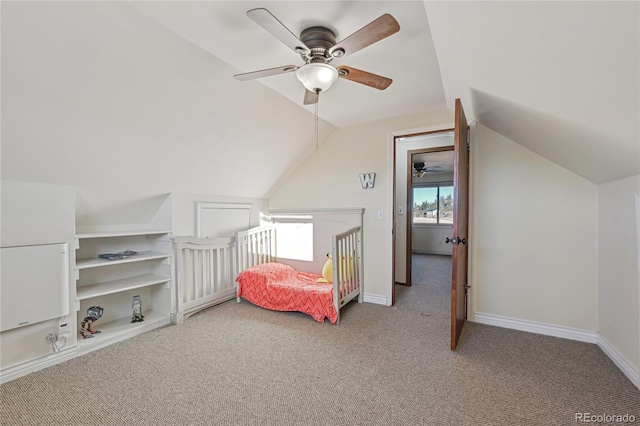 bedroom featuring ceiling fan, light carpet, and vaulted ceiling