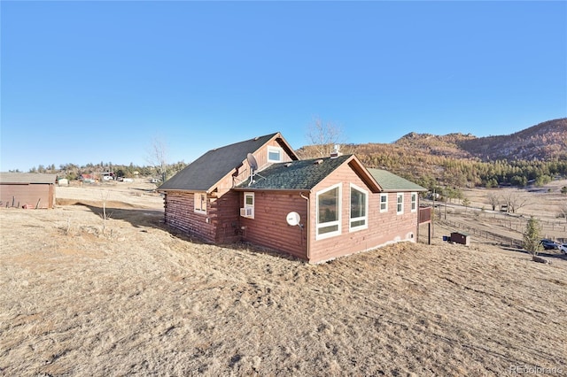 exterior space featuring a mountain view