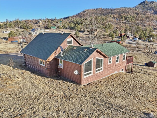 drone / aerial view featuring a mountain view