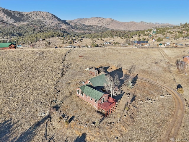 drone / aerial view featuring a mountain view and a rural view