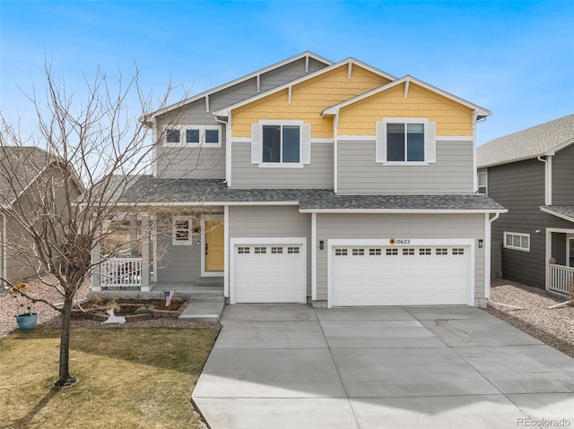 view of front of house featuring a garage, concrete driveway, a front yard, a shingled roof, and a porch