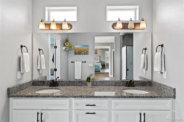 bathroom featuring double vanity and a sink