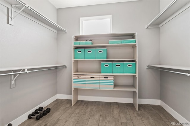 spacious closet with wood finished floors
