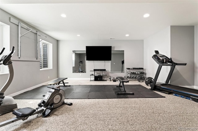exercise room with baseboards and recessed lighting