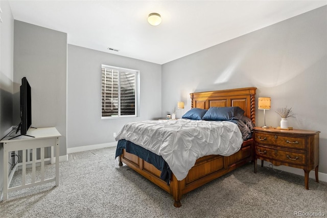 bedroom featuring baseboards, carpet floors, and visible vents