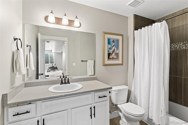 full bath with vanity, shower / tub combo, toilet, ensuite bath, and visible vents