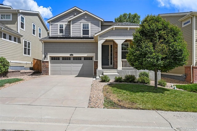 19659 W 59th Dr, Golden, CO 80403 - view of front of home featuring a garage, driveway, a porch, and stone siding