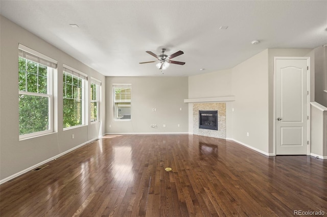 19659 W 59th Dr, Golden, CO 80403 - unfurnished living room featuring hardwood / wood-style flooring, ceiling fan, and a tiled fireplace