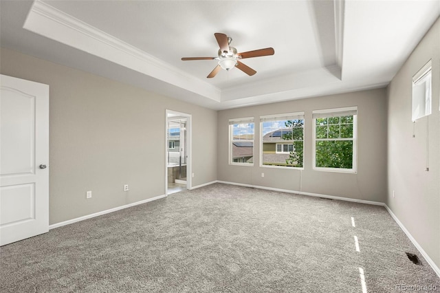 19659 W 59th Dr, Golden, CO 80403 - spare room with a tray ceiling, a ceiling fan, carpet floors, and ornamental molding
