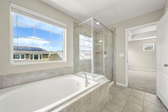 19659 W 59th Dr, Golden, CO 80403 - full bathroom featuring a bath, a shower stall, and tile patterned floors