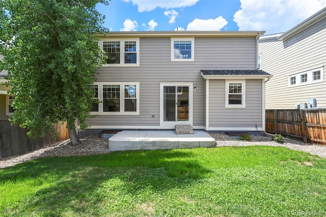 19659 W 59th Dr, Golden, CO 80403 - back of house with a fenced backyard and a patio area