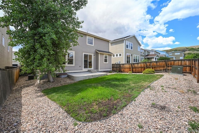 19659 W 59th Dr, Golden, CO 80403 - rear view of property with a patio and a fenced backyard