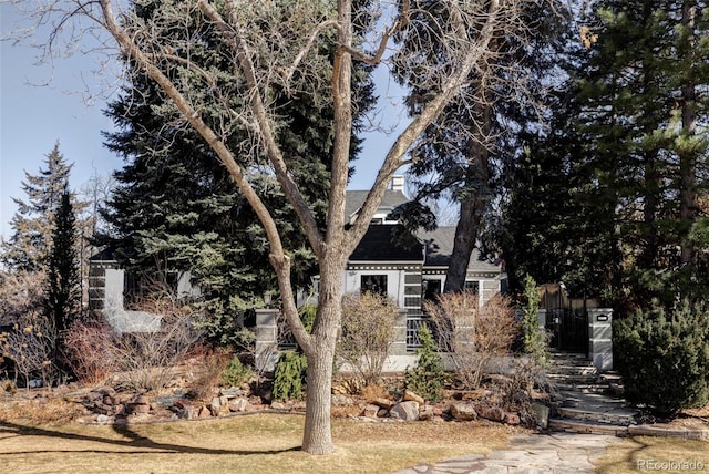 view of front of home featuring a shingled roof