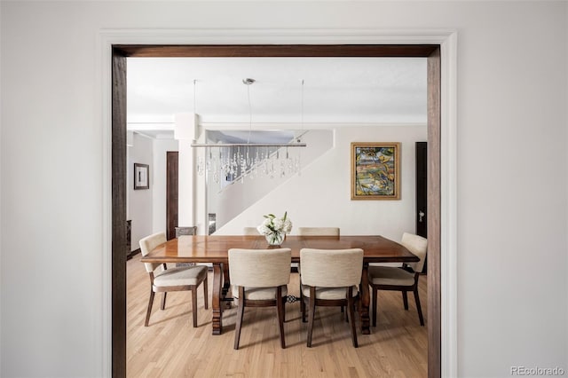 dining space with light wood-style flooring