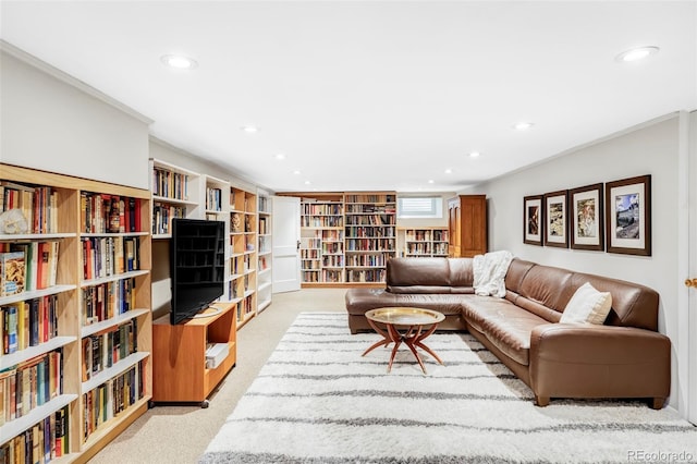 living room with carpet flooring, bookshelves, and recessed lighting