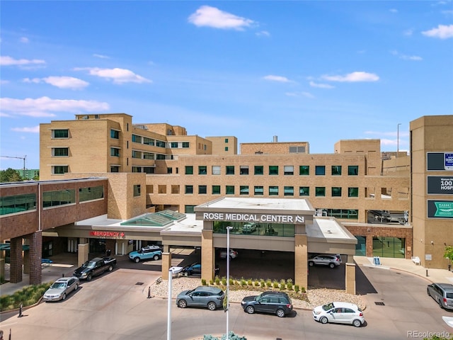 view of building exterior with parking