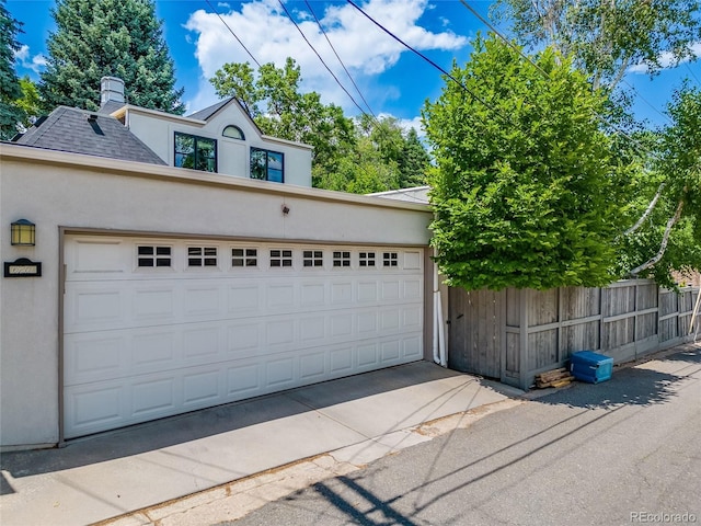 garage featuring fence