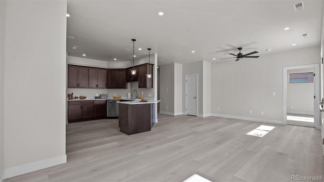 434 Clear Creek Dr, Grand Junction, CO 81504 - kitchen featuring open floor plan, stainless steel dishwasher, recessed lighting, light countertops, and dark brown cabinetry