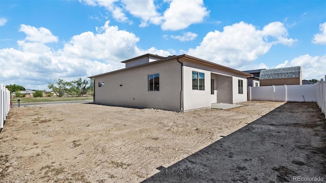 434 Clear Creek Dr, Grand Junction, CO 81504 - rear view of house featuring a fenced backyard and stucco siding