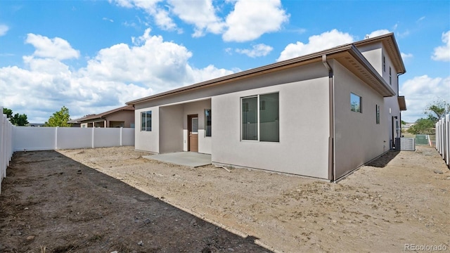 434 Clear Creek Dr, Grand Junction, CO 81504 - back of house with stucco siding and a fenced backyard