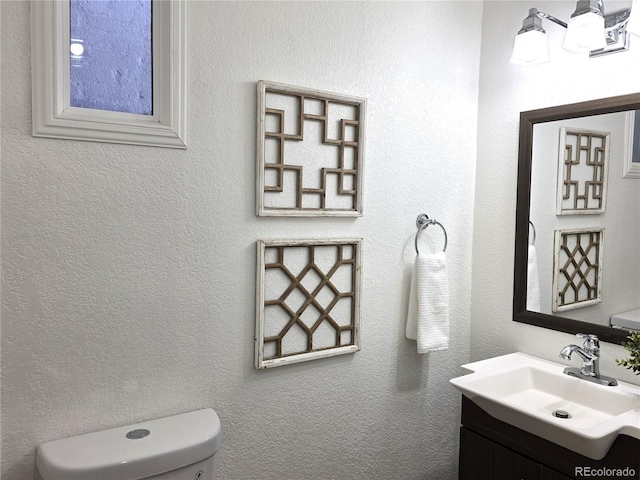 160 W Bayaud Ave, Denver, CO 80223 - bathroom featuring vanity and toilet