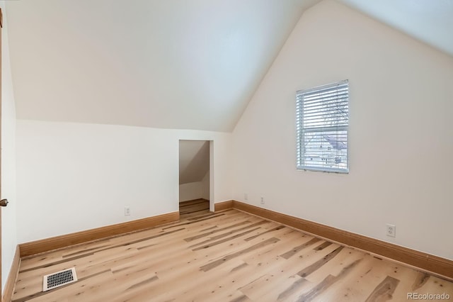 160 W Bayaud Ave, Denver, CO 80223 - additional living space featuring light wood-style flooring, lofted ceiling, and baseboards