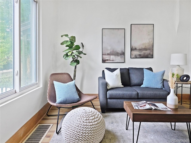 160 W Bayaud Ave, Denver, CO 80223 - living area with baseboards and light wood finished floors
