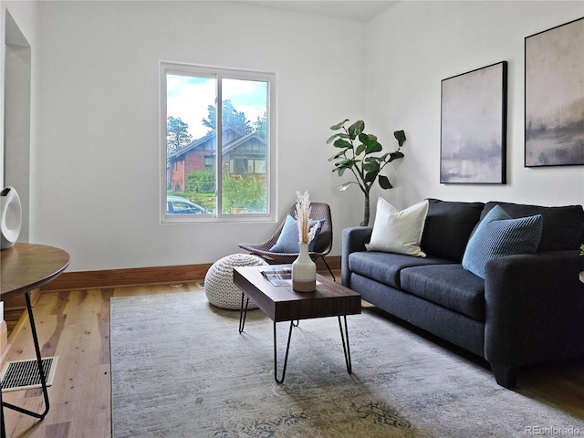 160 W Bayaud Ave, Denver, CO 80223 - living room featuring wood finished floors and baseboards