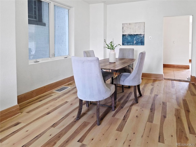 160 W Bayaud Ave, Denver, CO 80223 - dining room with light wood finished floors and baseboards