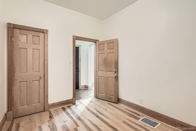 160 W Bayaud Ave, Denver, CO 80223 - empty room with light wood-type flooring and baseboards