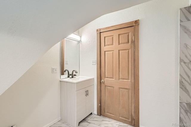 160 W Bayaud Ave, Denver, CO 80223 - bathroom featuring vanity and marble finish flooring