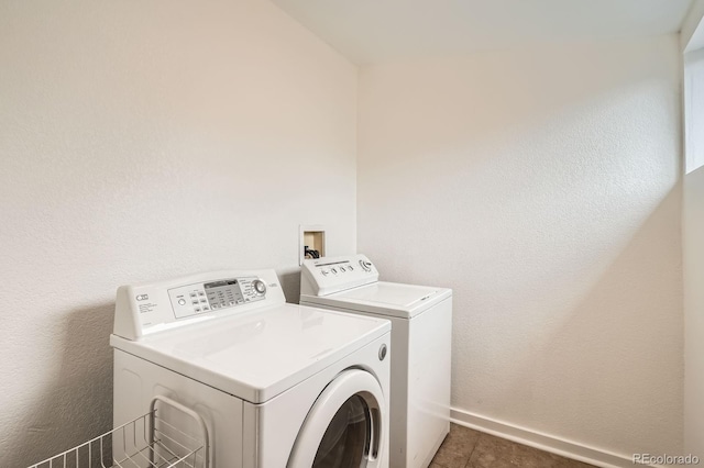 160 W Bayaud Ave, Denver, CO 80223 - laundry area featuring washing machine and clothes dryer and baseboards