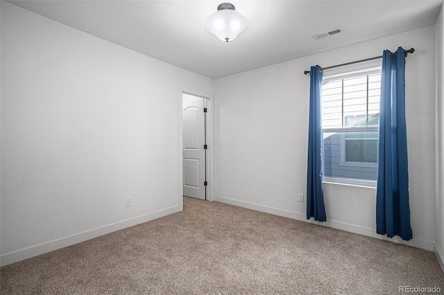 empty room featuring light colored carpet