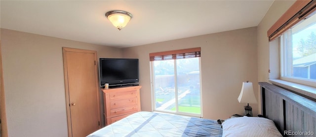 4901 Grove St, Denver, CO 80221 - bedroom featuring multiple windows and access to outside