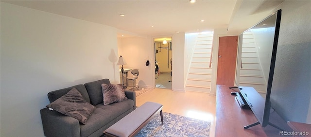 4901 Grove St, Denver, CO 80221 - living area with stairway, wood finished floors, recessed lighting, and washer / clothes dryer