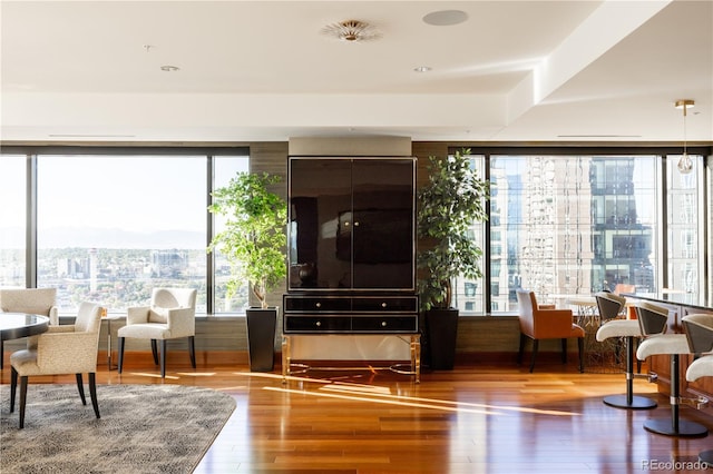 sitting room featuring a wealth of natural light and hardwood / wood-style floors