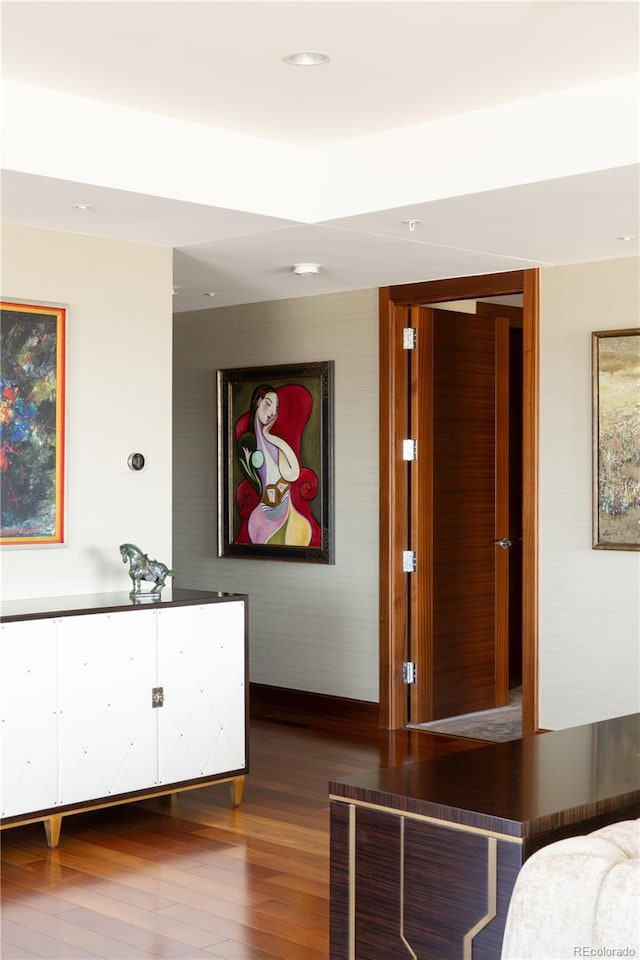 unfurnished bedroom with dark wood-type flooring