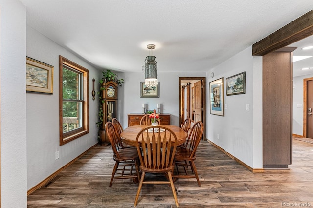 dining space featuring dark hardwood / wood-style floors