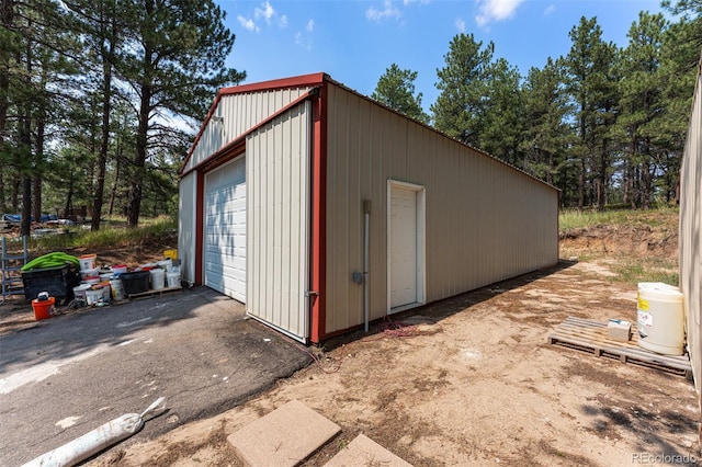 view of outbuilding with a garage